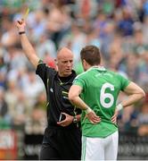 16 June 2013; Referee Cormac Reilly, issues a yellow Card to Ryan McCluskey, Fermanagh. Ulster GAA Football Senior Championship Quarter-Final, Cavan v Fermanagh, Brewster Park, Enniskillen, Co. Fermanagh. Picture credit: Oliver McVeigh / SPORTSFILE