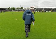 16 June 2013; Clare manager Mick O'Dwyer makes his way out for the start of the game. Munster GAA Football Senior Championship Semi-Final, Clare v Cork, Cusack Park, Ennis, Co. Clare. Picture credit: Matt Browne / SPORTSFILE