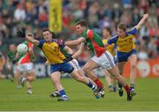 16 June 2013; Séamus O'Shea, Mayo, in action against Kevin Higgins, left, and Michael Finneran, Roscommon. Connacht GAA Football Senior Championship Semi-Final, Mayo v Roscommon, Elverys MacHale Park, Castlebar, Co. Mayo. Picture credit: Barry Cregg / SPORTSFILE