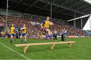 16 June 2013; Roscommon captain Cathal Cregg jumps over the team bench before the traditional team photograph. Connacht GAA Football Senior Championship Semi-Final, Mayo v Roscommon, Elverys MacHale Park, Castlebar, Co. Mayo. Picture credit: Barry Cregg / SPORTSFILE