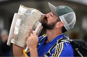 16 August 2019; Tipperary supporter Matt Shelbourne, from New York, with the Liam MacCarthy Cup at the GAA’s Home for the Match stand in the arrivals hall at Dublin Airport. Photo by Ramsey Cardy/Sportsfile