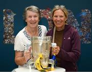 16 August 2019; Anne Smith, left, from Kilkenny City, and Denise Heuser, from Ohio, USA, with the Liam MacCarthy Cup at the GAA’s Home for the Match stand in the arrivals hall at Dublin Airport. Photo by Ramsey Cardy/Sportsfile