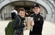 16 August 2019; 9 year old Darragh Fox, left, and brother 11 year old Cian, from Kilkenny City, with the Liam MacCarthy Cup at the GAA’s Home for the Match stand in the arrivals hall at Dublin Airport. Photo by Ramsey Cardy/Sportsfile