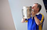 16 August 2019; Tipperary supporter Teddy Walsh, originally from Carrick on Suir, who has been living in Copenhagen for 40 years, with the Liam MacCarthy Cup at the GAA’s Home for the Match stand in the arrivals hall at Dublin Airport. Photo by Ramsey Cardy/Sportsfile