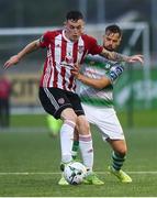 16 August 2019; David Parkhouse of Derry City in action against Greg Bolger of Shamrock Rovers  during the SSE Airtricity League Premier Division match between Derry City and Shamrock Rovers at the Ryan McBride Brandywell Stadium in Derry. Photo by Oliver McVeigh/Sportsfile
