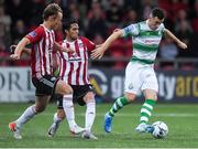 16 August 2019; Aaron Greene of Shamrock Rovers in action against Greg Sloggett and Gerardo Bruna of Derry City during the SSE Airtricity League Premier Division match between Derry City and Shamrock Rovers at the Ryan McBride Brandywell Stadium in Derry. Photo by Oliver McVeigh/Sportsfile