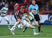 16 August 2019; Greg Sloggett of Derry City in action against Jack Byrne of Shamrock Roversduring the SSE Airtricity League Premier Division match between Derry City and Shamrock Rovers at the Ryan McBride Brandywell Stadium in Derry. Photo by Oliver McVeigh/Sportsfile
