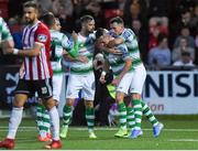 16 August 2019; Aaron McEneff of Shamrock Rovers, centre, celebrates with Greg Bolger and Aaron Greene after scoring his side's first goal during the SSE Airtricity League Premier Division match between Derry City and Shamrock Rovers at the Ryan McBride Brandywell Stadium in Derry. Photo by Oliver McVeigh/Sportsfile