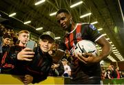 16 August 2019; Andre Wright of Bohemians poses for a photograph with Callum Costigan, aged 10, from Lucan, after scoring four goals during the SSE Airtricity League Premier Division match between Bohemians and UCD at Dalymount Park in Dublin. Photo by Sam Barnes/Sportsfile