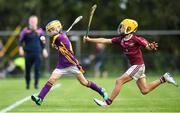 17 August 2019; Colm Ryan of Newport, Co Tipperary in action against Joe Dowling of Dicksboro, Co Kilkenny in the Hurling U11 Boys A final during Day 1 of the Aldi Community Games August Festival, which saw over 3,000 children take part in a fun-filled weekend at UL Sports Arena in University of Limerick, Limerick. Photo by David Fitzgerald/Sportsfile