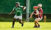 17 August 2019; Habeeb Olatokumbo of Ballincollig, Co Cork in action against Josh Dowling of Dicksboro, Co Kilkenny in the Hurling U11 Boys A semi-final during Day 1 of the Aldi Community Games August Festival, which saw over 3,000 children take part in a fun-filled weekend at UL Sports Arena in University of Limerick, Limerick. Photo by David Fitzgerald/Sportsfile