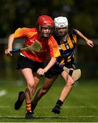 17 August 2019; Kate Ralph of Moycarkey-Borris, Co Tipperary in action against Grace Gleenon of Glenmore-Tullogher-Rosbercon in the Camogie U14 final during Day 1 of the Aldi Community Games August Festival, which saw over 3,000 children take part in a fun-filled weekend at UL Sports Arena in University of Limerick, Limerick. Photo by David Fitzgerald/Sportsfile