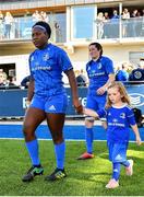 17 August 2019; Mascot Tara McKane, age 5, from Donore, Co. Meath, walks out with Leinster's Linda Djougang prior to the Women’s Interprovincial Rugby Championship match between Leinster and Connacht at Energia Park in Donnybrook, Dublin. Photo by Seb Daly/Sportsfile