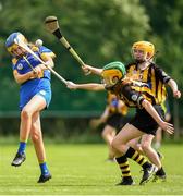 17 August 2019; Aoibhe Shankey of Portlaw-Ballyduff, Co Waterford in action against Mauve Bookle of Glenmore-Tullogher-Rosbercon, Co Kilkenny in the U14 Camogie semi-final during Day 1 of the Aldi Community Games August Festival, which saw over 3,000 children take part in a fun-filled weekend at UL Sports Arena in University of Limerick, Limerick. Photo by David Fitzgerald/Sportsfile