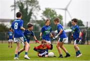 18 August 2019; Rory McDonald of St. Patrick's, Co. Cavan is surrounded by the Malahide, Co. Dublin, defence while competing in the U10 Boys/Girls/Mixed Gaelic Football during Day 2 of the Aldi Community Games August  Festival, which saw over 3,000 children take part in a fun-filled weekend at UL Sports Arena in University of Limerick, Limerick. Photo by Ben McShane/Sportsfile