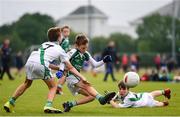 18 August 2019; Eoin Harris of Ballincollig, Co. Cork, scores his side's first goal despite the attention of Nicky Faherty, 7, of Moycullen, Co. Galway, competing in the U10 Boys/Girls/Mixed Gaelic Football during Day 2 of the Aldi Community Games August  Festival, which saw over 3,000 children take part in a fun-filled weekend at UL Sports Arena in University of Limerick, Limerick. Photo by Ben McShane/Sportsfile