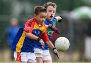 18 August 2019; James Kellegher of St. Patricks, Co. Cavan, in action against Stephen Joyce of Malahide, Co. Dublin, competing in the Boys/Girls/Mixed U10 Gaelic Football during Day 2 of the Aldi Community Games August  Festival, which saw over 3,000 children take part in a fun-filled weekend at UL Sports Arena in University of Limerick, Limerick. Photo by Ben McShane/Sportsfile