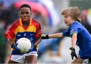 18 August 2019; Excel Imade of St. Patricks, Co. Cavan, in action against Conor Doyle of Malahide, Co. Dublin, competing in the Boys/Girls/Mixed U10 Gaelic Football during Day 2 of the Aldi Community Games August  Festival, which saw over 3,000 children take part in a fun-filled weekend at UL Sports Arena in University of Limerick, Limerick. Photo by Ben McShane/Sportsfile