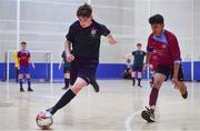 18 August 2019; Eoin Ager of Kilmaine, Co Mayo in action against Edwin Saju of Caherdavin, Co Limerick in the Futsal U15 boys semi-final during Day 2 of the Aldi Community Games August Festival, which saw over 3,000 children take part in a fun-filled weekend at UL Sports Arena in University of Limerick, Limerick. Photo by David Fitzgerald/Sportsfile