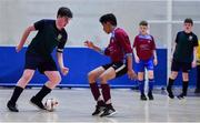 18 August 2019; Shane Flannery of Kilmaine, Co Mayo in action against Edwin Saju of Caherdavin, Co Limerick in the Futsal U15 boys semi-final during Day 2 of the Aldi Community Games August Festival, which saw over 3,000 children take part in a fun-filled weekend at UL Sports Arena in University of Limerick, Limerick. Photo by David Fitzgerald/Sportsfile