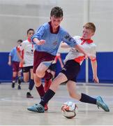 18 August 2019; Patrick Faulker of Caherdavin, Co Limerick in action against Keith McCarthy of Enniskeane, Co Cork in the U13 Futsal final during Day 2 of the Aldi Community Games August Festival, which saw over 3,000 children take part in a fun-filled weekend at UL Sports Arena in University of Limerick, Limerick. Photo by David Fitzgerald/Sportsfile