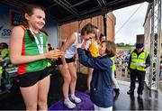 18 August 2019; Olympian and Community Games Ambassador Olive Loughnane presents the gold medal to Cara Laverty of Steelstown, Co Derry after she won the girls U16 1500m during Day 2 of the Aldi Community Games August Festival, which saw over 3,000 children take part in a fun-filled weekend at UL Sports Arena in University of Limerick, Limerick. Photo by David Fitzgerald/Sportsfile