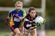 18 August 2019; Orlagh McCarthy of Skibbereen, Co. Cork in action against Philipa Smith of Erne Valley, Co. Cavan, competing in the Girls U12 Gaelic Football during Day 2 of the Aldi Community Games August  Festival, which saw over 3,000 children take part in a fun-filled weekend at UL Sports Arena in University of Limerick, Limerick. Photo by Ben McShane/Sportsfile