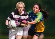 18 August 2019; Ria Buckley of Skibbereen, Co. Cork in action against Saorlo Carey of Erne Valley, Co. Cavan, competing in the Girls U12 Gaelic Football during Day 2 of the Aldi Community Games August  Festival, which saw over 3,000 children take part in a fun-filled weekend at UL Sports Arena in University of Limerick, Limerick. Photo by Ben McShane/Sportsfile