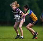 18 August 2019; Emma O'Donovan of Skibbereen, Co. Cork in action against Kyra Comaskey of Erne Valley, Co. Cavan, competing in the Girls U12 Gaelic Football during Day 2 of the Aldi Community Games August  Festival, which saw over 3,000 children take part in a fun-filled weekend at UL Sports Arena in University of Limerick, Limerick. Photo by Ben McShane/Sportsfile