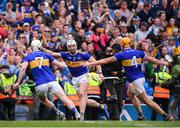 18 August 2019; Tipperary players, from left, Séamus Kennedy, Padraic Maher and Ronan Maher celebrate following the GAA Hurling All-Ireland Senior Championship Final match between Kilkenny and Tipperary at Croke Park in Dublin. Photo by Stephen McCarthy/Sportsfile