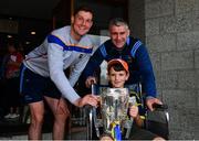 19 August 2019; Séamus Callanan of Tipperary, left, and Tipperary manager Liam Sheedy with Luke Marum, aged 10, from Portlaoise, and the Liam MacCarthy Cup on a visit by the Tipperary All-Ireland hurling champions to Children's Health Ireland at Crumlin in Dublin.  Photo by Sam Barnes/Sportsfile