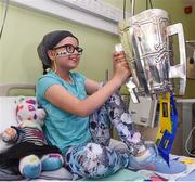 19 August 2019; Carla O'Connor aged 10, from Carrick on Suir, Co Tipperary, with the Liam MacCarthy cup on a visit by the Tipperary All-Ireland hurling champions to Children's Health Ireland at Crumlin in Dublin.  Photo by Sam Barnes/Sportsfile