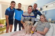 19 August 2019; Ciara Sugrue with Tipperary players, from left, Barry Heffernan, Jerome Cahill, Séamus Callanan, Tipperary manager Liam Sheedy and the Liam MacCarthy Cup on a visit by the Tipperary All-Ireland hurling champions to Children's Health Ireland at Crumlin in Dublin.  Photo by Sam Barnes/Sportsfile