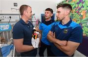 19 August 2019; Shay Treacy, aged 5 days, with his father James Treacy, from Callan, Co. Kilkenny, and Tipperary players Niall O’Meara, centre, and  Joe O'Dwyer on a visit by the Tipperary All-Ireland hurling champions to Children's Health Ireland at Crumlin in Dublin.  Photo by Sam Barnes/Sportsfile