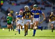 18 August 2019; Anna O'Neill, Corpus Christi GNS, Drumcondra, Dublin, representing Kilkenny, in action against Shauna MacSweeney, St. Patrick’s NS, Bunclody, Wexford, representing Tipperary, during the INTO Cumann na mBunscol GAA Respect Exhibition Go Games prior to the GAA Hurling All-Ireland Senior Championship Final match between Kilkenny and Tipperary at Croke Park in Dublin. Photo by Ray McManus/Sportsfile