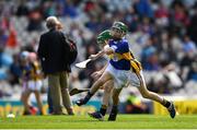 18 August 2019; Seán Farrell, Donaskeigh NS, Dundrum, Tipperary, representing Tipperary, in action against Colin McAweeney, Scoil Assaim, Raheny, Dublin, representing Kilkenny, during the INTO Cumann na mBunscol GAA Respect Exhibition Go Games prior to the GAA Hurling All-Ireland Senior Championship Final match between Kilkenny and Tipperary at Croke Park in Dublin. Photo by Eóin Noonan/Sportsfile