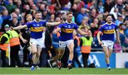 18 August 2019; Tipperary players, from left, Donagh Maher, Dan McCormack, and Alan Flynn celebrate after the GAA Hurling All-Ireland Senior Championship Final match between Kilkenny and Tipperary at Croke Park in Dublin. Photo by Piaras Ó Mídheach/Sportsfile