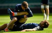 23 August 2019; Iain Henderson is treated by physiotherapist Colm Fuller during the Ireland Rugby captain's run at Twickenham Stadium in London, England. Photo by Ramsey Cardy/Sportsfile
