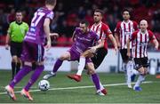 23 August 2019; Michael Duffy of Dundalk in action against Darren Cole of Derry City  during the Extra.ie FAI Cup Second Round match between Derry City and Dundalk at Ryan McBride Brandywell Stadium in Derry. Photo by Oliver McVeigh/Sportsfile