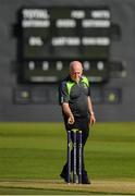 24 August 2019; Umpire Alan Neill tends to the stumps prior to the Clear Currency Irish Senior Cup Final match between Waringstown CC and Pembroke CC at The Hills Cricket Club in Skerries, Dublin. Photo by Seb Daly/Sportsfile