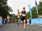 24 August 2019; Jan Corcoran of Le Chéile AC celebrates on her way to finishing fifth in the Women's Frank Duffy 10 Mile race. Over 5,200 runners took part in the Frank Duffy 10 Mile, part of the KBC Dublin Race Series 2019 at Phoenix Park in Dublin. Photo by Sam Barnes/Sportsfile
