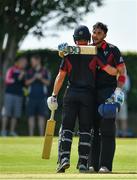 24 August 2019; Shaheen Khan of Pembroke CC, right, is congratulated by team-mate Barry McCarthy after scoring a century during the Clear Currency Irish Senior Cup Final match between Waringstown CC and Pembroke CC at The Hills Cricket Club in Skerries, Dublin. Photo by Seb Daly/Sportsfile