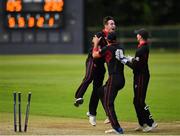 24 August 2019; Josh Little of Pembroke CC, left, celebrates with team-mates after bowling out Lee Nelson of Waringstown CC during the Clear Currency Irish Senior Cup Final match between Waringstown CC and Pembroke CC at The Hills Cricket Club in Skerries, Dublin. Photo by Seb Daly/Sportsfile