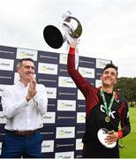 24 August 2019; Pembroke CC captain Fiachra Tucker lifts the trophy following his side's victory during the Clear Currency Irish Senior Cup Final match between Waringstown CC and Pembroke CC at The Hills Cricket Club in Skerries, Dublin. Photo by Seb Daly/Sportsfile