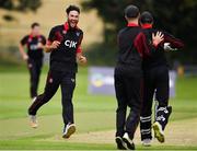 24 August 2019; Shaheen Khan of Pembroke CC, left, celebrates with team-mates following his side's victory during the Clear Currency Irish Senior Cup Final match between Waringstown CC and Pembroke CC at The Hills Cricket Club in Skerries, Dublin. Photo by Seb Daly/Sportsfile