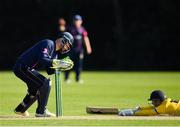 25 August 2019; Chris Dougherty of CIYMS attempts to run out Fintan McAllister of Malahide during the All-Ireland T20 Cricket Final match between CIYMS and Malahide at Stormont in Belfast. Photo by Seb Daly/Sportsfile