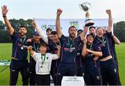 25 August 2019; CIYMS captain Nigel Jones lifts the trophy as he celebrates with team-mate following their side's victory during the All-Ireland T20 Cricket Final match between CIYMS and Malahide at Stormont in Belfast. Photo by Seb Daly/Sportsfile