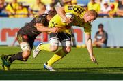 25 August 2019; George Merrick of Clermont is tackled by Romain Sazy of La Rochelle during the LNR Top 14 match between ASM Clermont Auvergne and La Rochelle at Stade Marcel-Michelin in Clermont-Ferrand, France. Photo by Romain Biard/Sportsfile