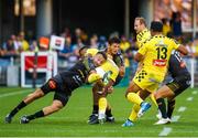 25 August 2019; Judicael Cancoriet of Clermont is tackled during the LNR Top 14 match between ASM Clermont Auvergne and La Rochelle at Stade Marcel-Michelin in Clermont-Ferrand, France. Photo by Romain Biard/Sportsfile