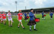 24 August 2019; Cork captain James Keating leads his team-mates in the pre-match parade behind the St Patrick's Pipe Band, from Tulla, Co Clare, before the Bord Gáis Energy GAA Hurling All-Ireland U20 Championship Final match between Cork and Tipperary at LIT Gaelic Grounds in Limerick. Photo by Piaras Ó Mídheach/Sportsfile